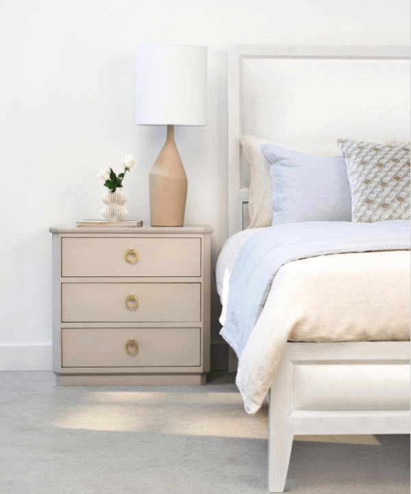 bedside nightstand with lamp on top